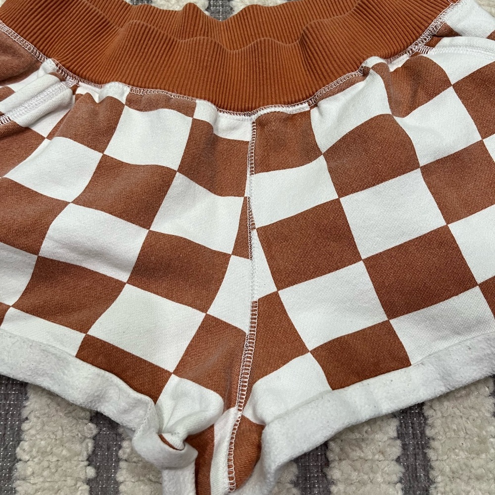 Out from under checkered shorts - Picture 3 of 11